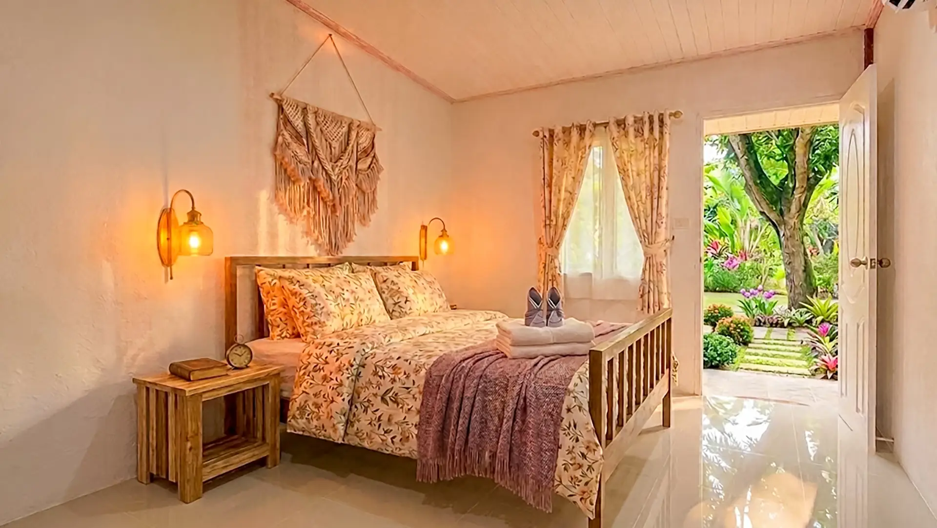 Panpurie Garden Terrace King room with door opening directly onto a lush tropical garden