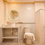 ROOM-03-07-150x150 ROOM-03-07-150x150 En-suite bathroom with round LED mirror, vessel sink, and walk-in rain shower at Panpurie Garden Terrace room Accommodations ROOM 03 07 150x150
